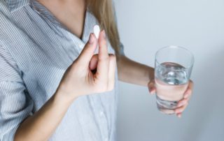 woman taking medication