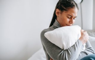 woman clutching pillow